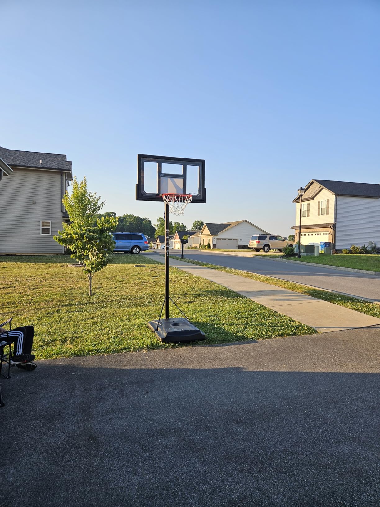 Lifetime 1529 Courtside Height Adjustable Portable Basketball System, 50 Inch Shatterproof Backboard, Black/Red/Blue, Standard customer photo 1