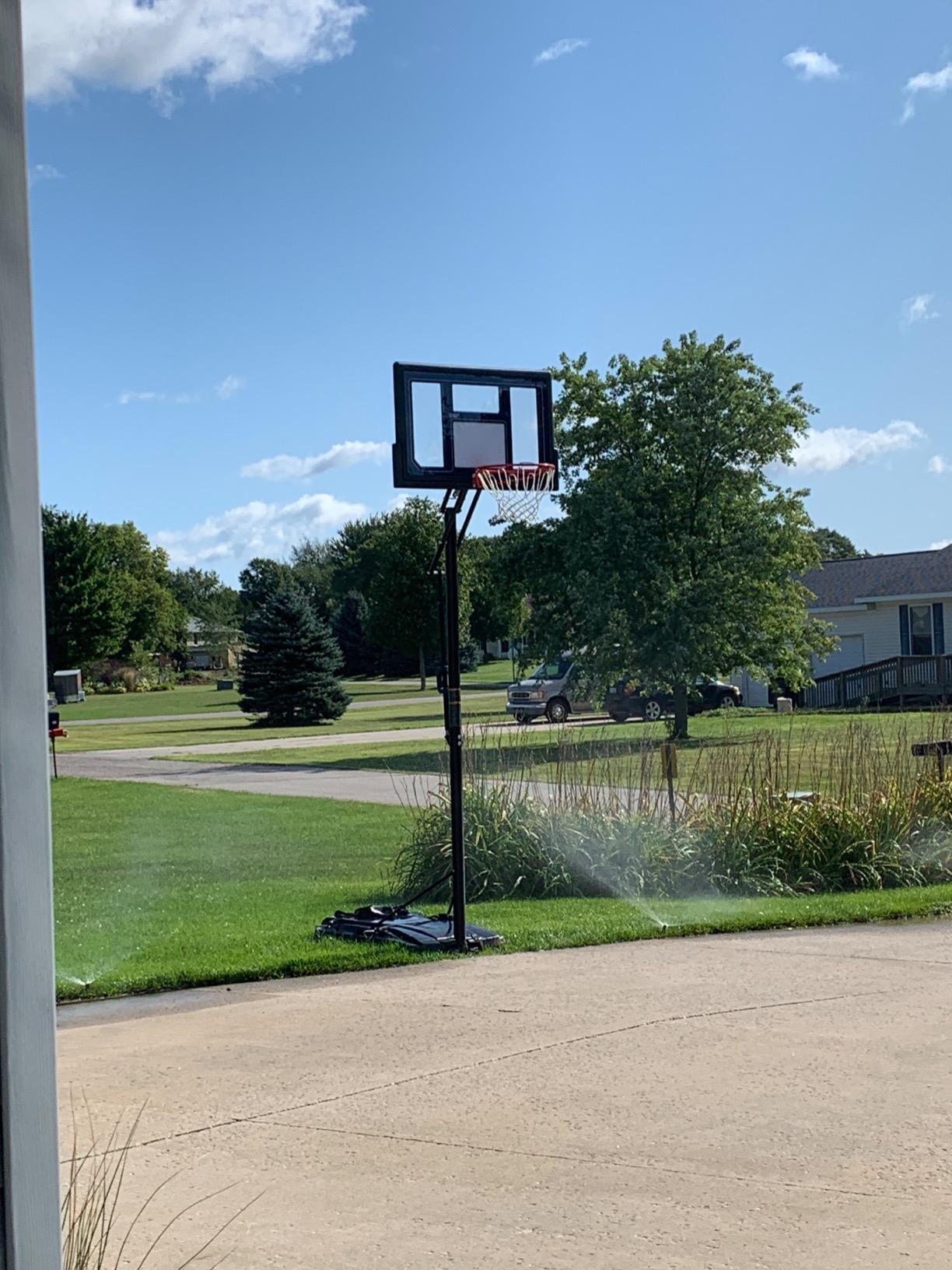 Lifetime 1529 Courtside Height Adjustable Portable Basketball System, 50 Inch Shatterproof Backboard, Black/Red/Blue, Standard customer photo 2