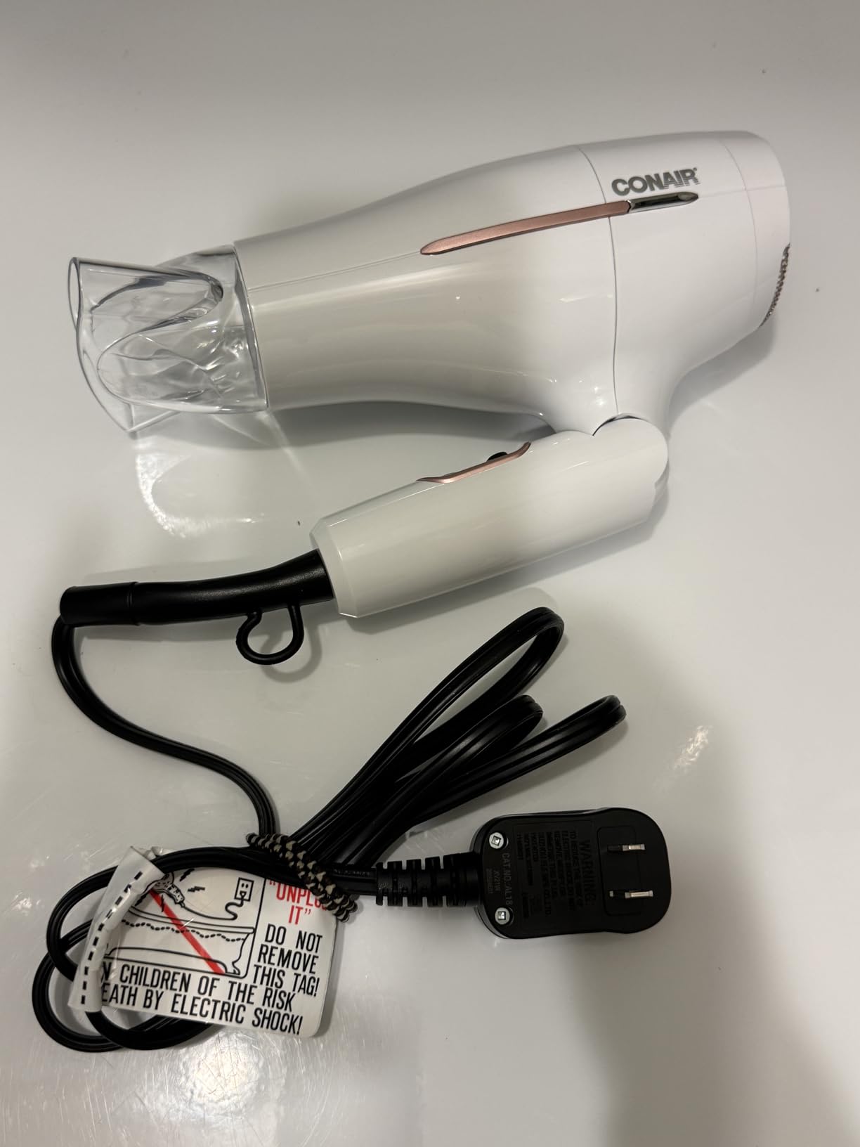 Conair Worldwide Folding Handle Hair Dryer with Concentrator & Diffuser, 1875W Travel Blow Dryer with Smart Voltage Technology, Ionic Conditioning Fights Frizz, 3 Heat & 2 Speed Settings, Purple customer photo 2